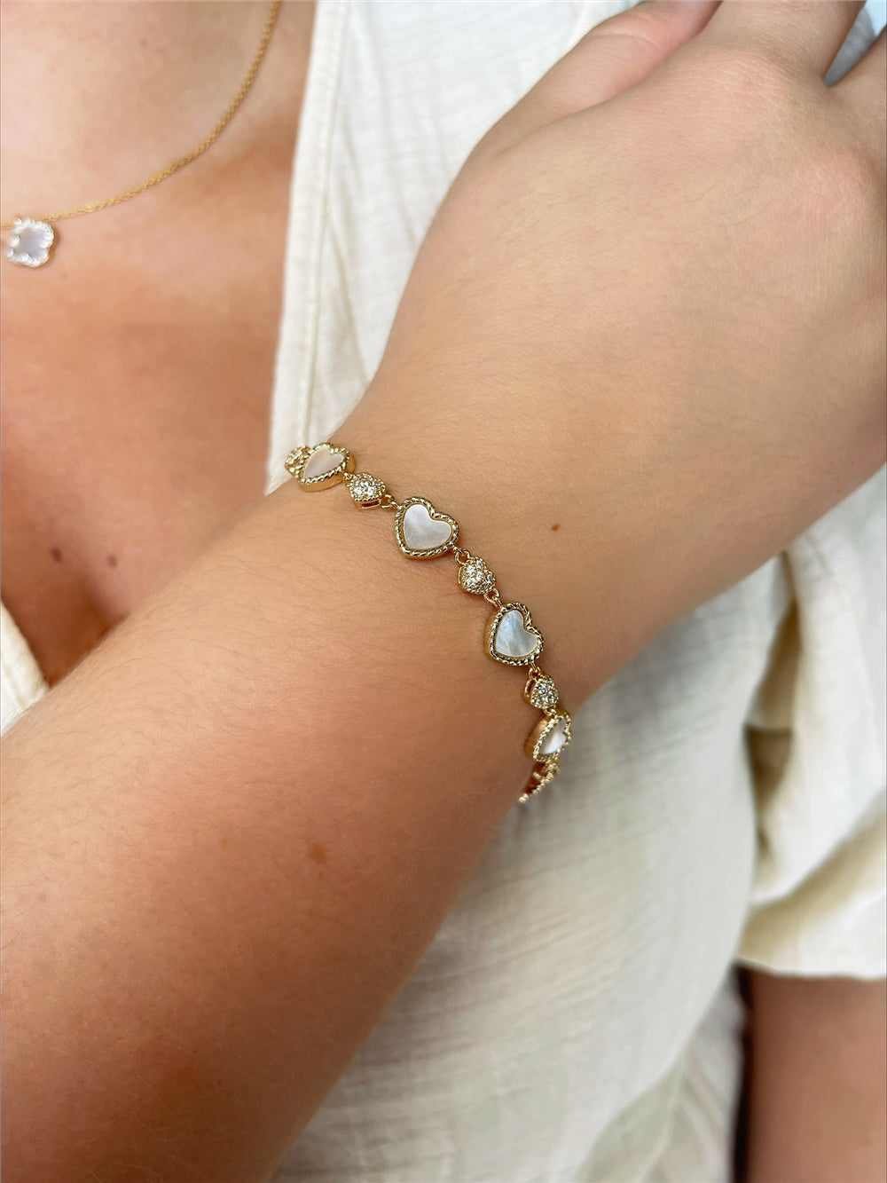 August Woods Gold Mother of Pearl Heart Pull Bracelet