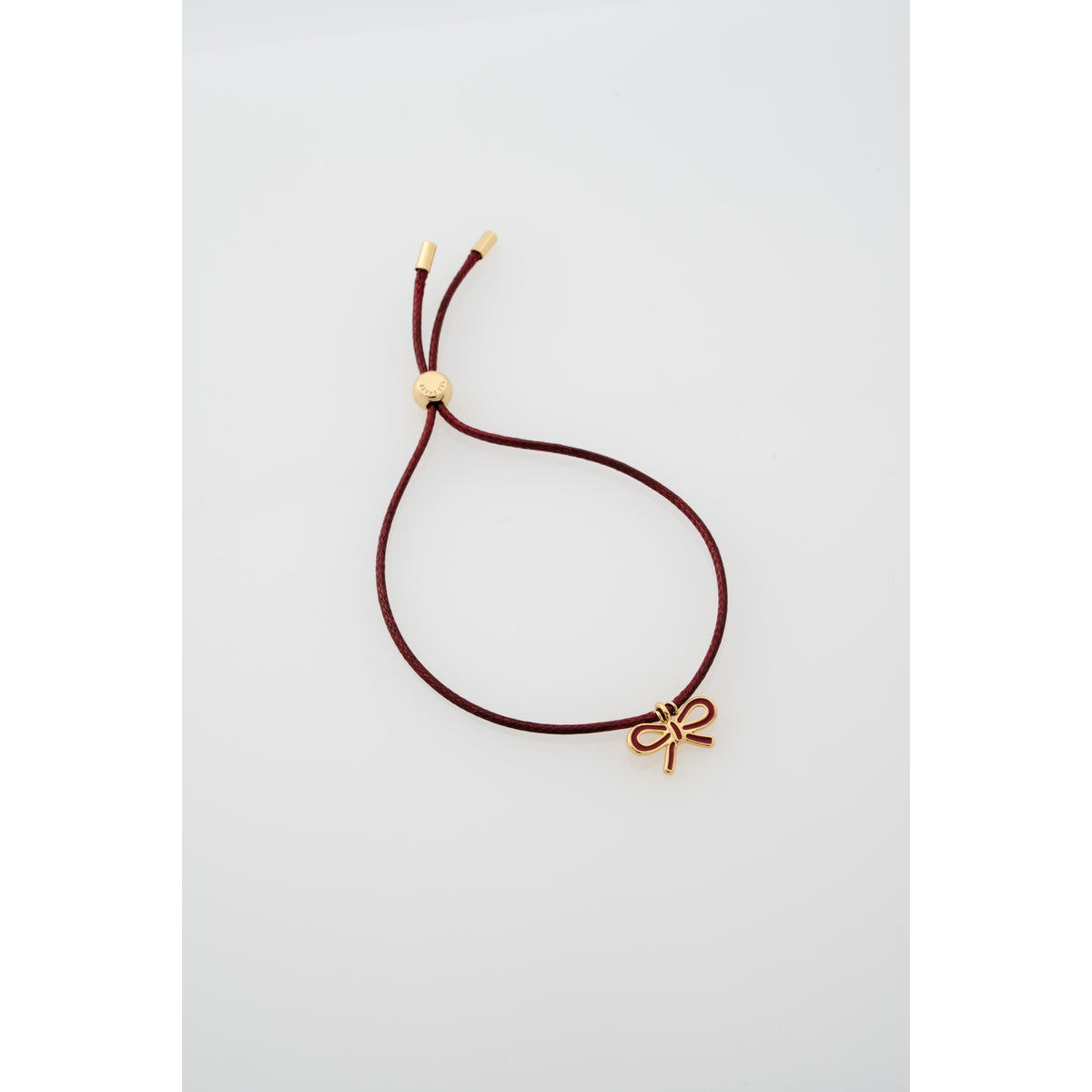 Ted Baker Gold Ruby Enamel Ribbon Bow Cord Slider Bracelet